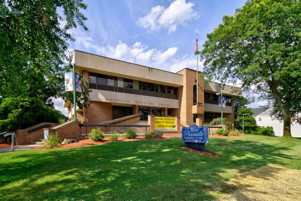 Plainville, Connecticut Town Hall - Picture from https://en.wikipedia.org/wiki/Plainville,_Connecticut#/media/File:Plainville,_Connecticut_Municipal_Center.jpg.